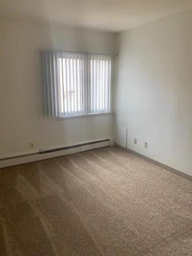 Room with carpet and window